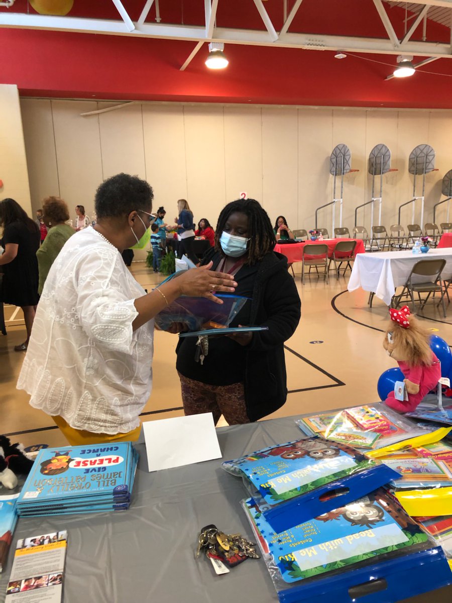Parent Educator Cynthia Kenion discussing kindergarten readiness with parent at kindergarten registration on Friday April 29, 2022.