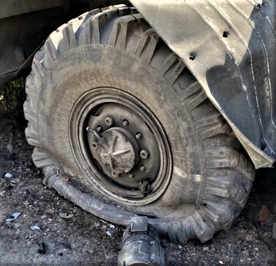 Let's take a closer look at a clip of the front tire in the photo after I've played with the light & color.There are cracks in the sidewall consistent with a really old tire along with rubber peeling debris at the bottom in the tire fold.2/