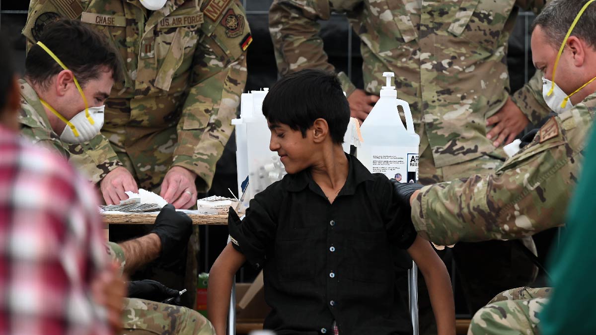 CDCMMWR's tweet photo. New MMWR describes successful effort to contain measles among Afghan evacuees during #OAW in fall 2021 through mass vaccination campaigns that achieved high vaccination coverage &amp; prevented possible complications &amp; deaths. https://t.co/u4bCTtglqc 
Photo: @DeptofDefense https://t.co/RflRQ6jAws