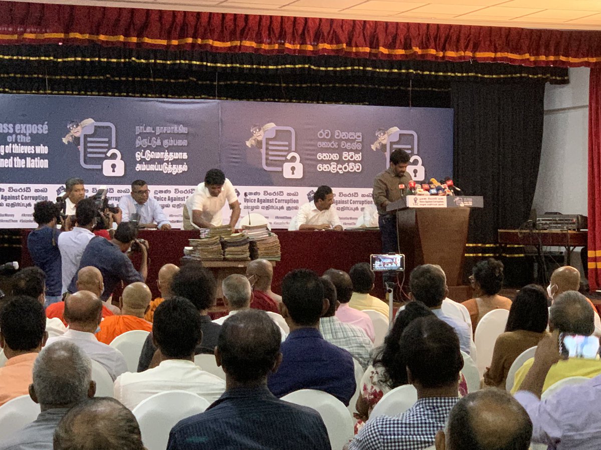 VraieB's tweet photo. Having exposed 5 massive cases of corruption, @anuradisanayake asks the audience to pick a file of their choice from the stall stack of files on corruption - from ministers, corporates, politicians to state official!#GiveUsOurStolenMoneyBack  #Pannamu https://t.co/etsT0e1NQ6