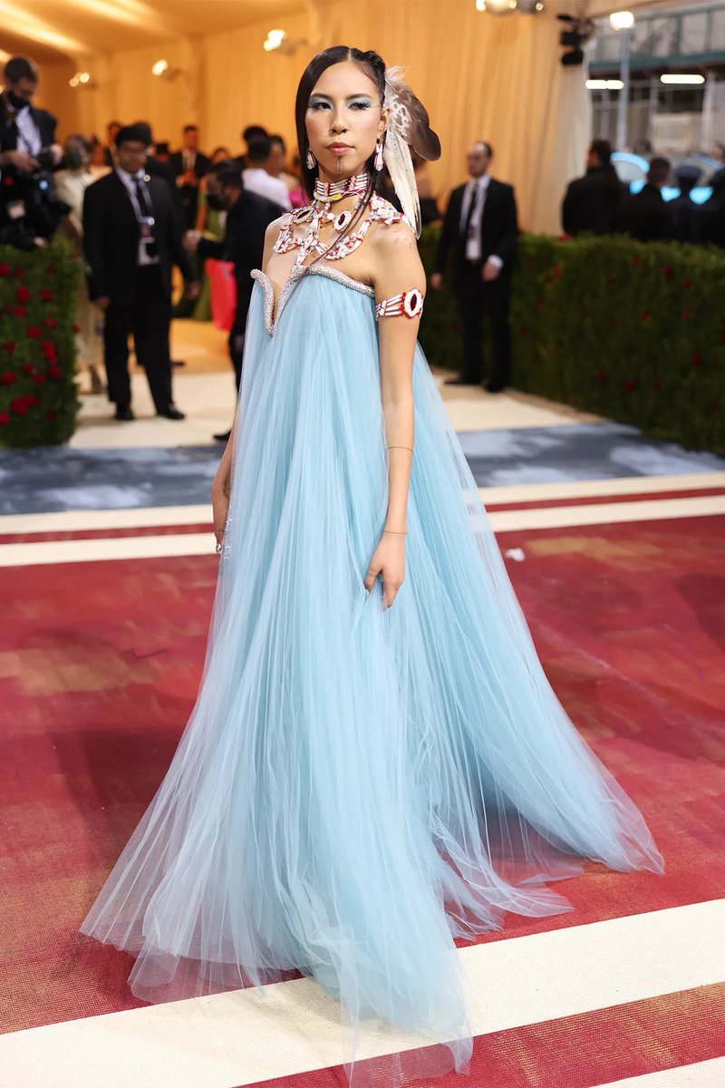 KiwiDiva's tweet photo. Quannah Chasinghorse, a native 👑 Hän Gwich'in from her mother's side (in Alaska) and Sicangu-Oglala Lakota from her father's side. Photos from the #MetGala today. She could wear any designer but she always honors her heritage. The Gilded Age was not a golden time for Natives. 🪶 https://t.co/BKDI20VZ3D