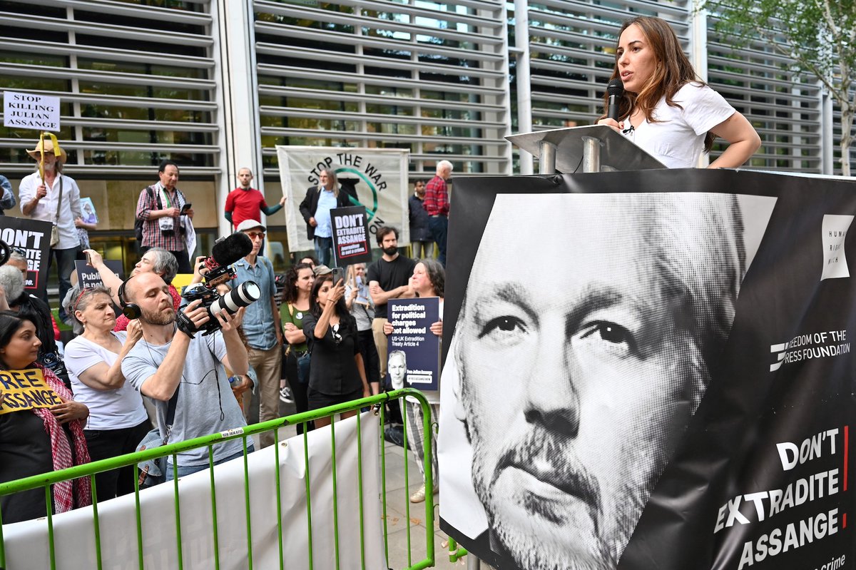 TRTWorldNow's tweet photo. In pictures: Demonstrators hold banners and placards as they gather in front of the Home Office building, in London, during a demonstration to protest against the extradition of WikiLeaks founder Julian Assange to the US https://t.co/gCLIERM7ni