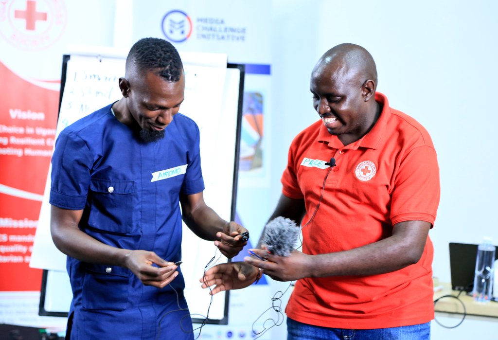 IMChallengeug's tweet photo. .@KisemboAntonio guides the @UgandaRedCross communications volunteers and branch managers on how to set up a mobile journalism (#MOJO) kit during the #MobileStorytellingLab at the @mcimediahub. https://t.co/BAHm3Ww5KM