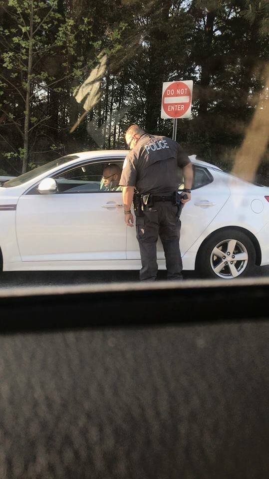 Solomon33John's tweet photo. #IFearForMyLife This brother is getting his license, registration, & insurance papers ready to hand to the cop in broad daylight, but look what the cop already has his hand on. If you are this scared find a new job. We are all this close to being a #HASHTAG.👇🏿 https://t.co/7B0cRZEuz5