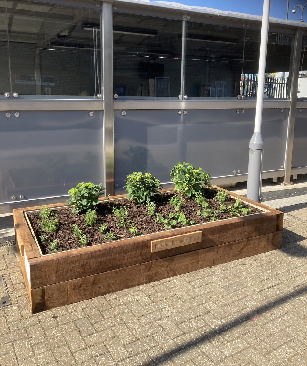 GreenFeltham's tweet photo. Exciting to have our new planter at Feltham station, ahead of the Queen’s Jubilee celebrations. Will be red, white and blue flowers along the front (we hope!). @CommunitySWR @CommunityRail Thanks to funding from @LBofHounslow and @bee_trust #FelthamInBloom https://t.co/F6QF2OPV5d