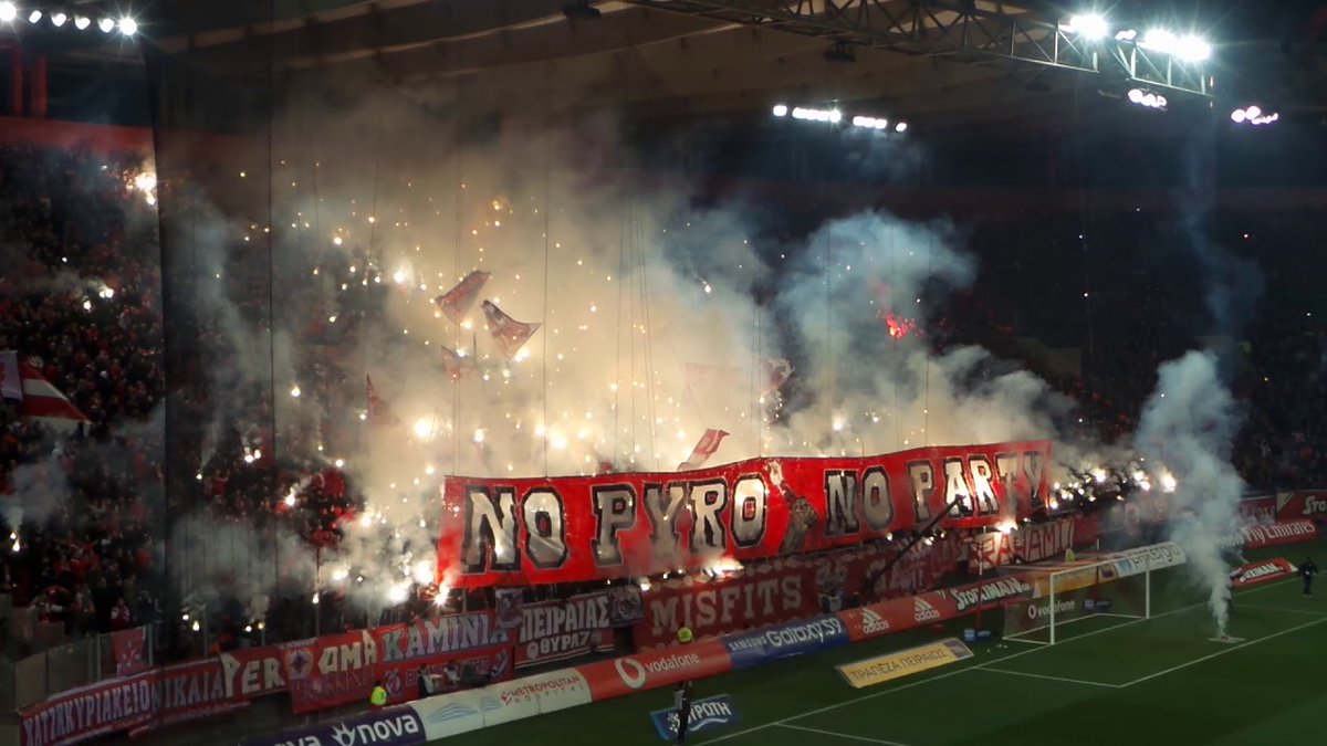 A pyro show by Gate 7 Misfits, ultra group of Olympiacos FC.

But our question, why do so many Greek ultra groups adopt the word "Gate" in English in their names?