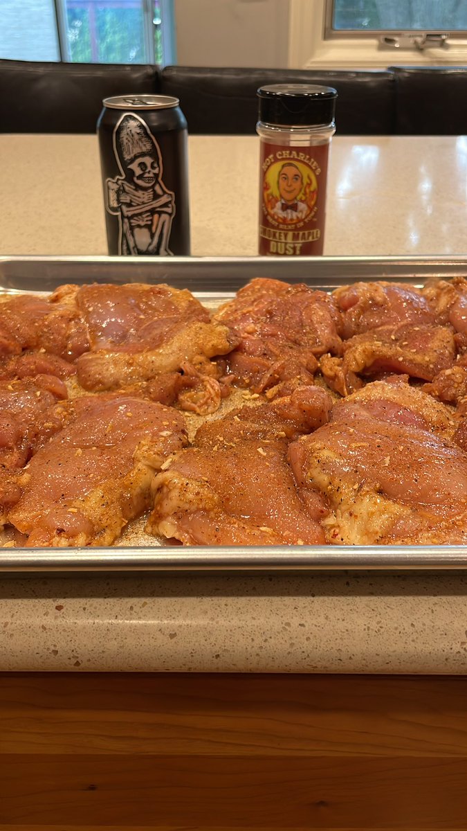 Step 3: Rub olive oil all over the chicken thighs and season with your favorite dry rub. This afternoon I’m using <a href="/hotcharlies/">Hot Charlie's</a> Smokey Maple Dust!