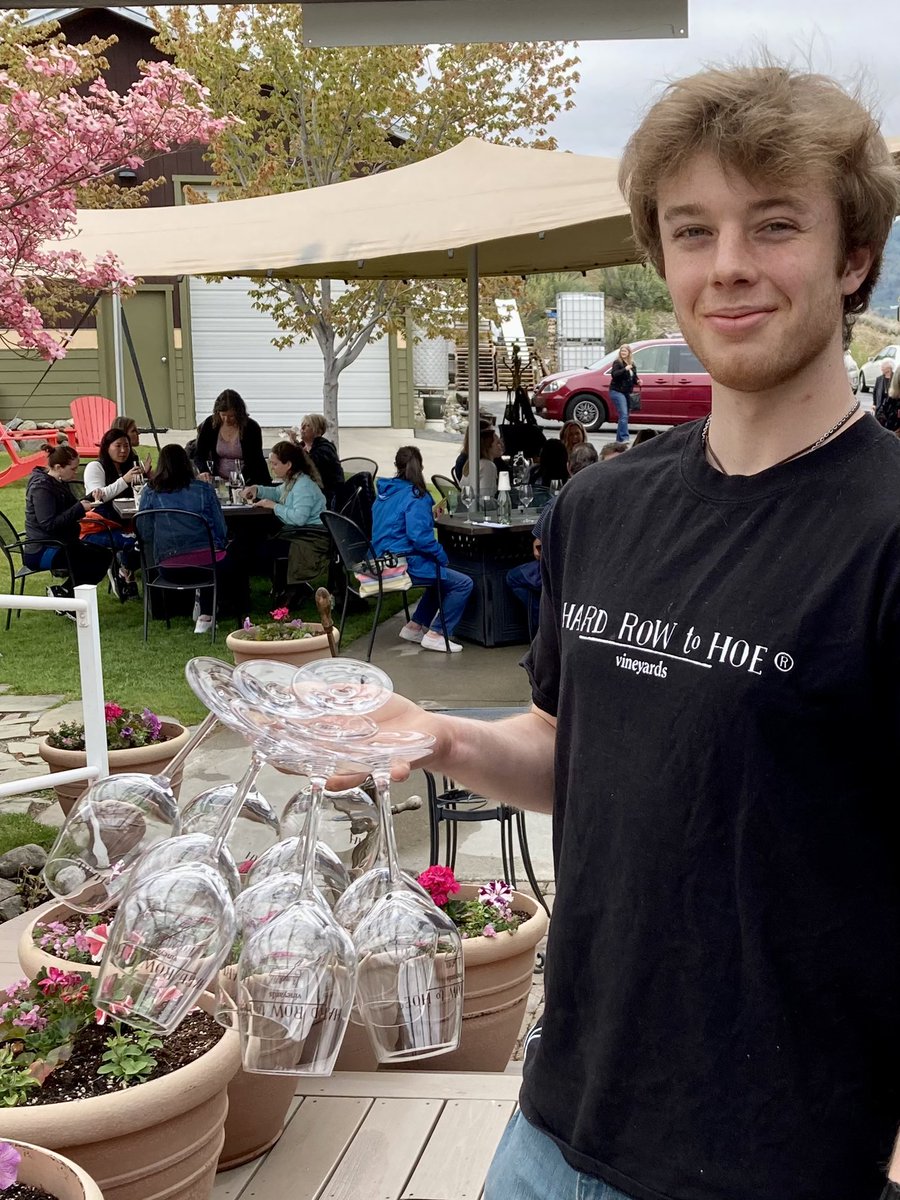 HardRow's tweet photo. The skies finally cleared yesterday for Chardonnay Day and we got busy, real quick! Here’s Liam getting wine glasses into everyone’s hands. #lakechelan #hrth https://t.co/9uiVzNQql1