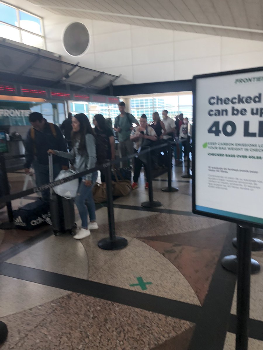 AnnMcLeod's tweet photo. @FlyFrontier thought 4: staff up…both the depart and return you did not have a dedicated bag drop line open and also everyone was up there w an agent rearranging luggage due to this policy https://t.co/07gi3booUV