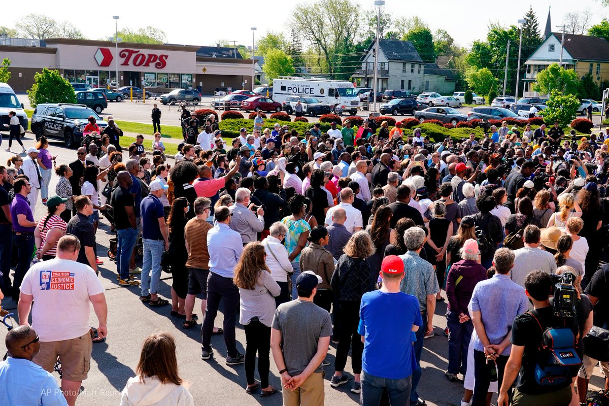 AP's tweet photo. Authorities said the white gunman showed up at the store with the “express purpose” of killing Black people. Community members marched and prayed outside of the supermarket on Sunday, a day after the attack. https://t.co/rP2Qv6YjYa https://t.co/WYQLOi0Ikg