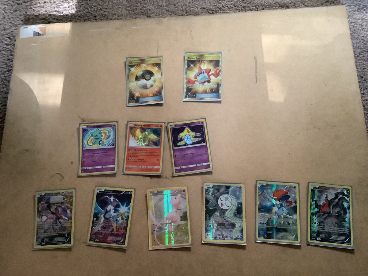 WynnFoxy's tweet photo. How much are all of these worth in total (or individually) nowadays? The Mythical Pokémon below are all full art holographic promos from the 2016 era (20th Anniversary) all in good condition and locked away #pokemon #pokemoncards #pokemontcg #primetimepokemon #secretrarepokemon https://t.co/7DyMZC2L1d