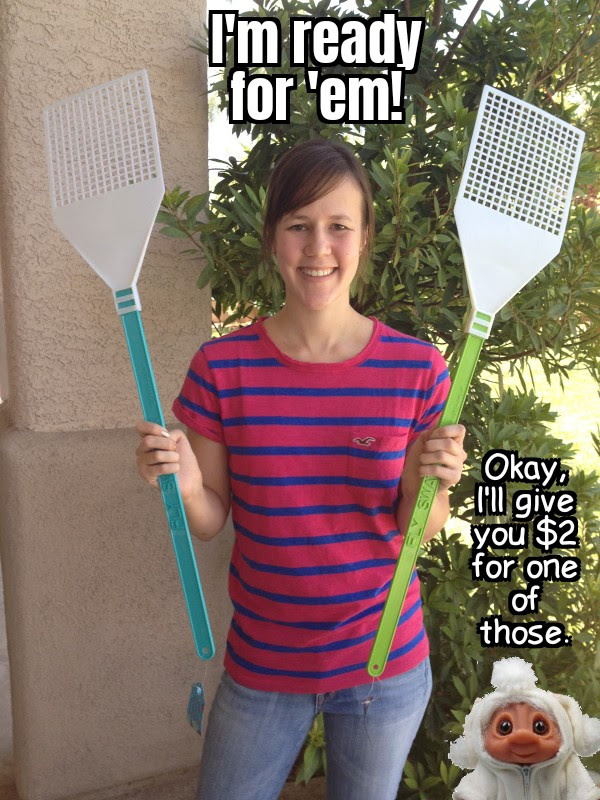 Woman with two giant fly swatters, and troll lady (me) standing next to her.