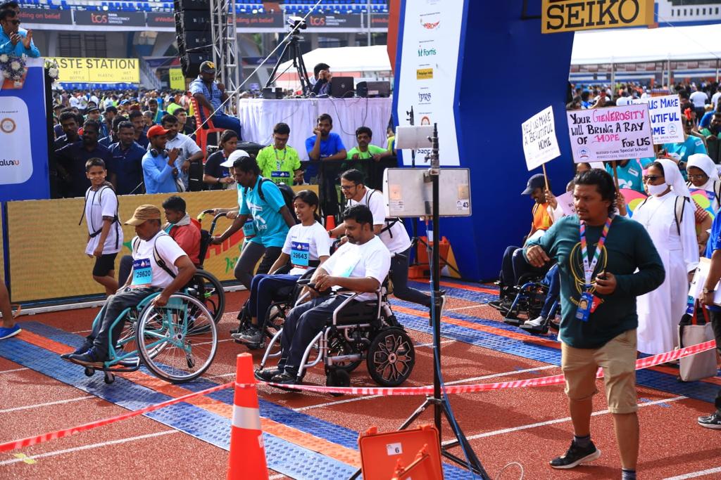 TCS's tweet photo. The 14th edition of the #TCSW10k run concluded with high spirits and happy faces in #Bengaluru, India. We witnessed an elite line up of customers, TCS employees and passionate runners from across the globe. #WeBelieveBengaluru #Buildingonbelief #OneTCS https://t.co/Xa6Ll85bAb