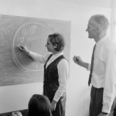 naagovau's tweet photo. Mr D J Daly, one of the specialist teachers at the Fitzroy High School watches Violetta Marciano, 17, draw a clock on the blackboard in 1969.
#WorldDrawingDay
NAA: A12111, 1/1969/31/2 https://t.co/wJR5mVcQzP