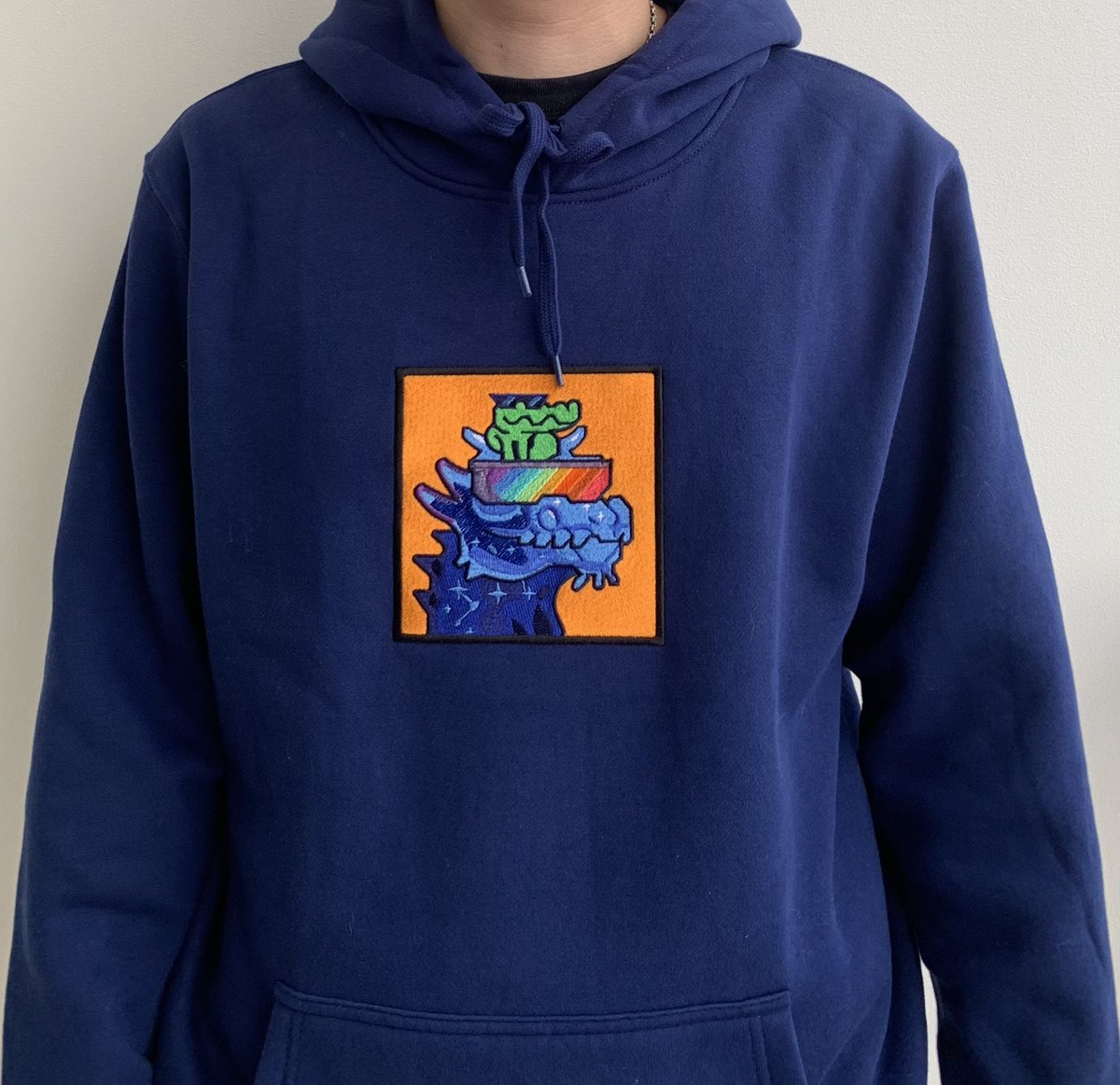SaintCapital88's tweet photo. I just recieved the best gift from my girlfriend, @beebumblebeenft. 🧡

Thanks @embroidery_boy for the quality hoodie, now I can rock my @BoryokuDragonz wherever I go 🐉 https://t.co/NYgzv0bpll