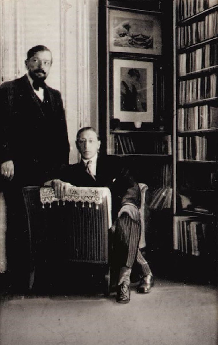 Eric Satie took this photo of Claude Debussy &amp; Igor Stravinsky in the library of Debussy’s home in Paris in 1912–13. 
Christie’s sold this rare gelatin silver print for $2,233 in 2001.
￼