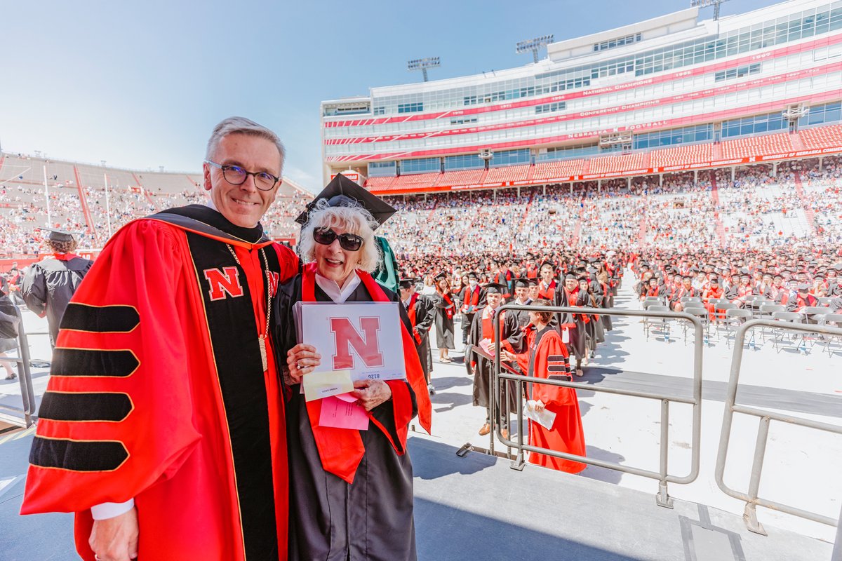 UNLincoln's tweet photo. “I did the work..I just didn't get to stay and finish my hours.” On May 14, Carol Livingston crossed the stage &amp; received her @NebraskaBiz degree—a moment 63 years in the making—with her family cheering her on from the stands. Read her story: https://t.co/IngK6vx6mD #GoBigGrad https://t.co/Mbyb1HwR03