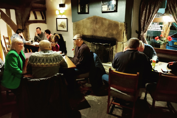 Image is of people at a previous quiz in the pub