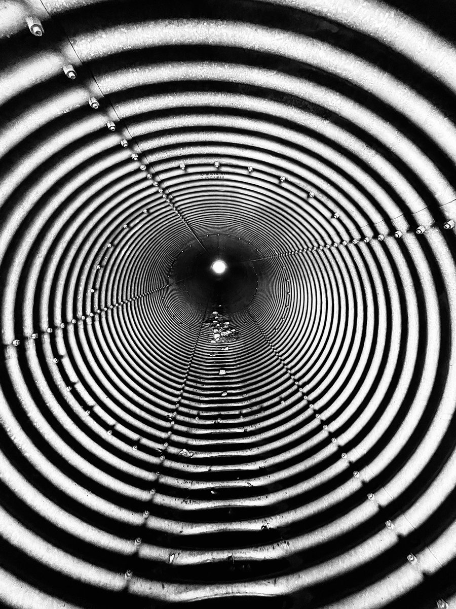 austinvivstudio's tweet photo. My friends and I were poking around the desert when we rolled up to this.  It’s a culvert out in West Texas.  Kind of a cool shot. #iPhone12ProMax #westtexas #transpecos #photography #trippyphoto #blackandwhitephoto #blackandwhite #blackandwhitephotography https://t.co/Fsfyb0dQNr