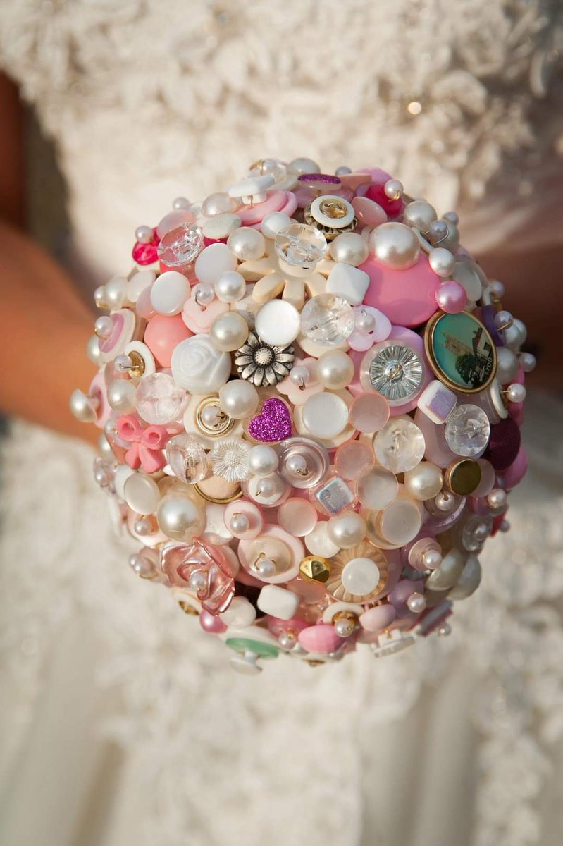 CassInTheAttic's tweet photo. @BootstrapCook This was my niece Holly's bouquet from her wedding. Every button came from my late mum's (her grandma's) huge glass jar of buttons.. ❤️ https://t.co/pU7f6meMmU