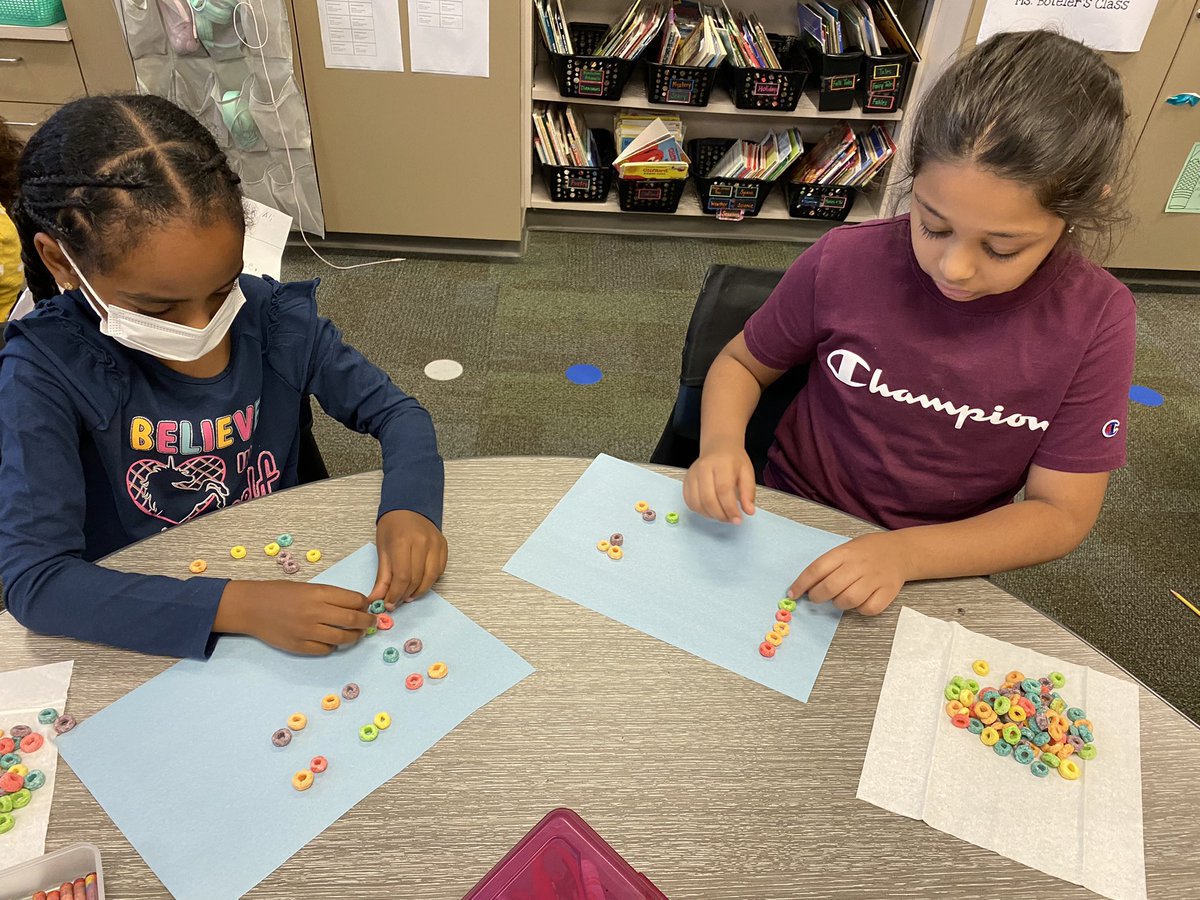 Working on our multiplication and division by combining/dividing equal groups with Fruit Loops #teambce