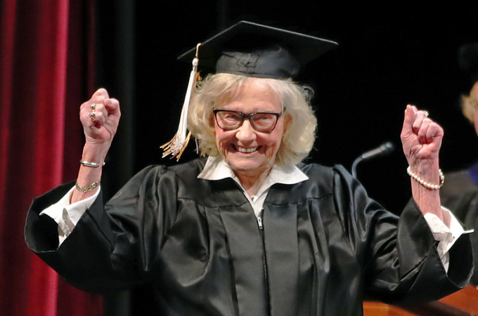 Betty Sandison reacts as her name is read during the College of Continuing and Professional Studies commencement ceremony on May 7.