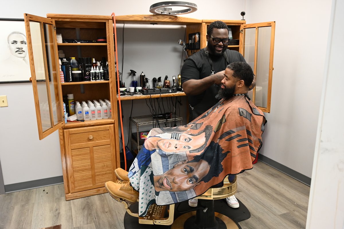 MySouthSide's tweet photo. Larry "Lduz" Moore perfects his client’s haircut at his #Syracuse #barbershop in the Mary Nelson Youth Center.

Moore is the son of Nelson. The center, along with his shop, recently received a renovation from HGTV, as part of the Lowe’s 100 Hometowns initiative.

📸 Tanner Hogan https://t.co/xDbBz47T08