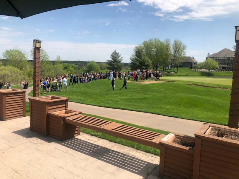 High heels and putting greens don't mix.   Thanks Shakopee prom!