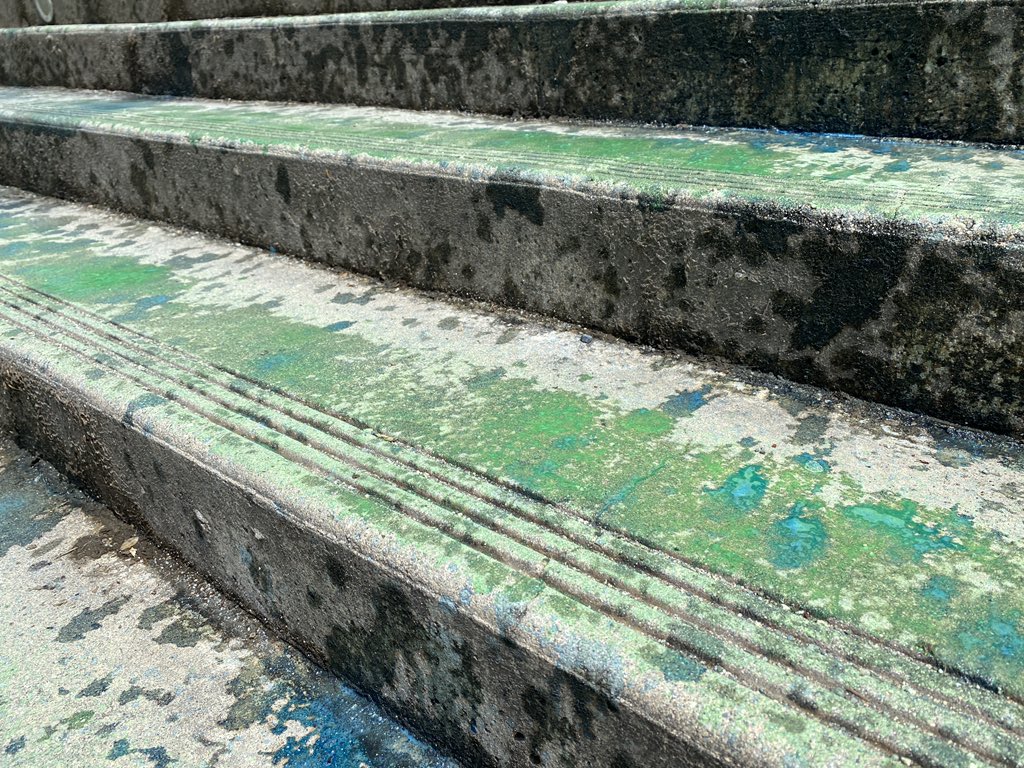 jimfong604's tweet photo. @saveoldgrowth protestor glues hands to UBC library. Stairs are also painted blue and green in protest of fossil fuel. @CTVVancouver https://t.co/VHGzwbNvo2
