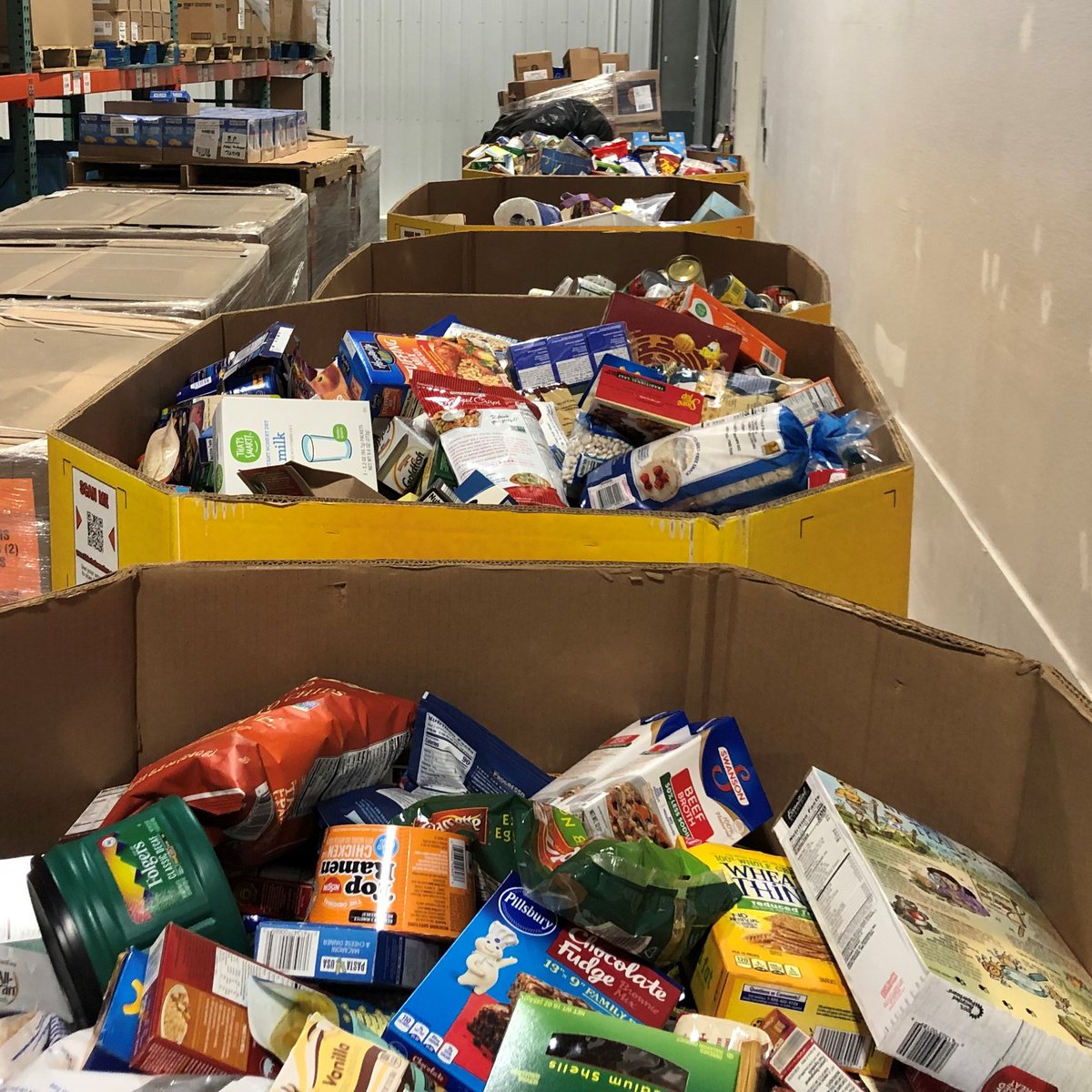 NDFoodBank's tweet photo. Pallets are stacked up two-high inside the #greatplainsfoodbank warehouse of food collected over the weekend from the @StampOutHunger Food Drive! In total, 9,671 pounds was collected, which is enough to provide more than 8,000 meals. Thank you to all who donated! #StampOutHunger https://t.co/A4acqxwhl0