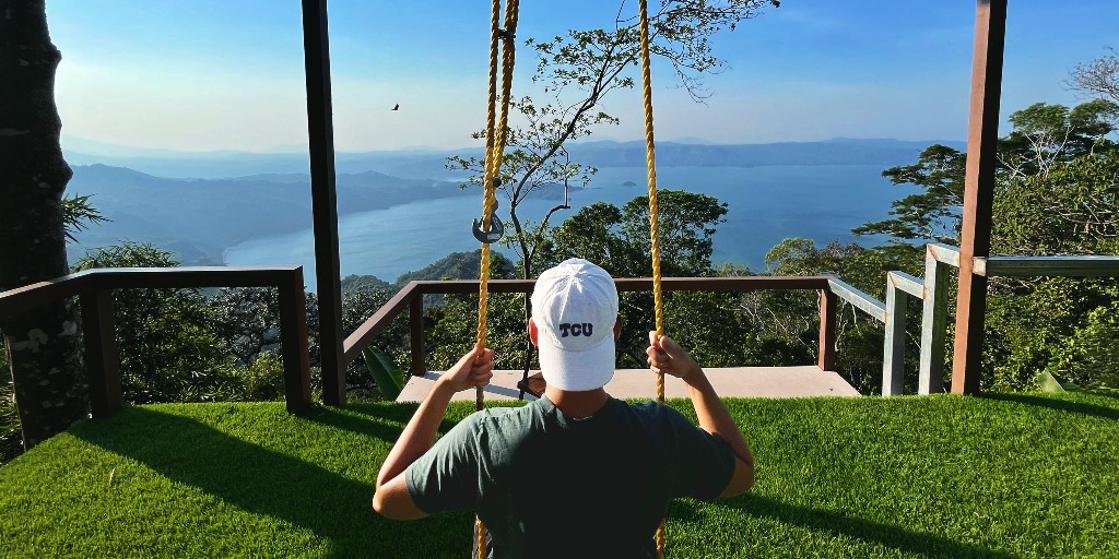 TCU's tweet photo. Where are you representing TCU this summer? TCU student, Kenji Fujiwara is showing off his TCU pride in beautiful El Salvador! #myTCUsummer https://t.co/LsqbXfbbmf