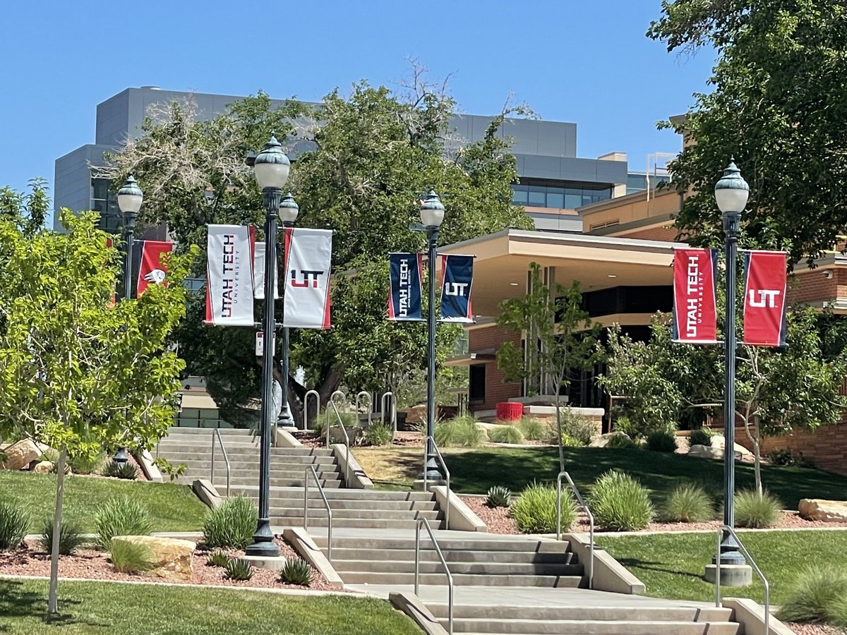The name change from Dixie State University to #utahtech University is legally official on July 1, but today the university rolled out the rebranding campaign. Faculty &amp; staff got new IDs &amp; branded shirts &amp; so many signs &amp; flags around campus are in the process of changing. 1/2