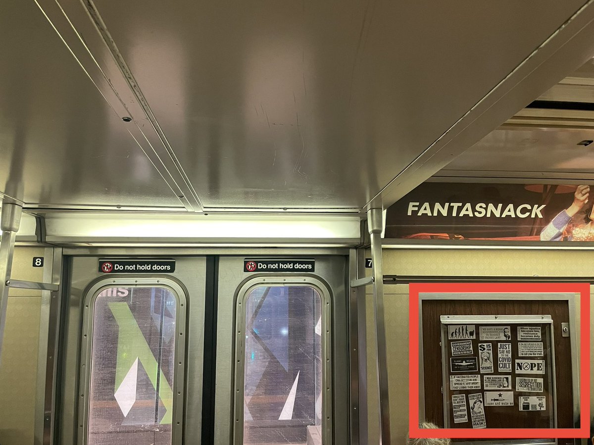 _williamestes's tweet photo. @MTA missing ad = Covid denial. Astoria-bound N train, car 5779, door 7 https://t.co/tBMHF33ovx