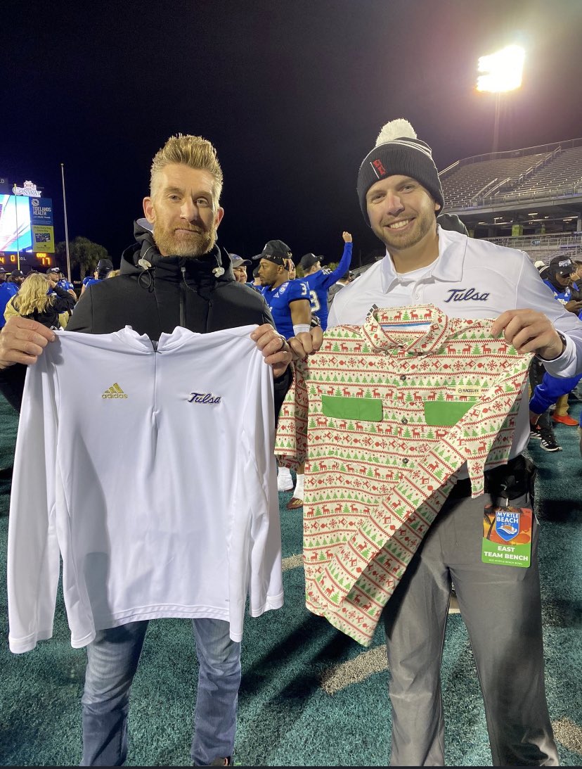 nickbaril's tweet photo. Scott, you can’t let @MartySmithESPN out Tulsa you! Photo from @MBBowlGame … swing thru and try on the JuJu, SVP! @TulsaEQRoom @TulsaHurricane @MattMuller5 #OnGamedaysWeWearJuJu https://t.co/UC19SckaG1