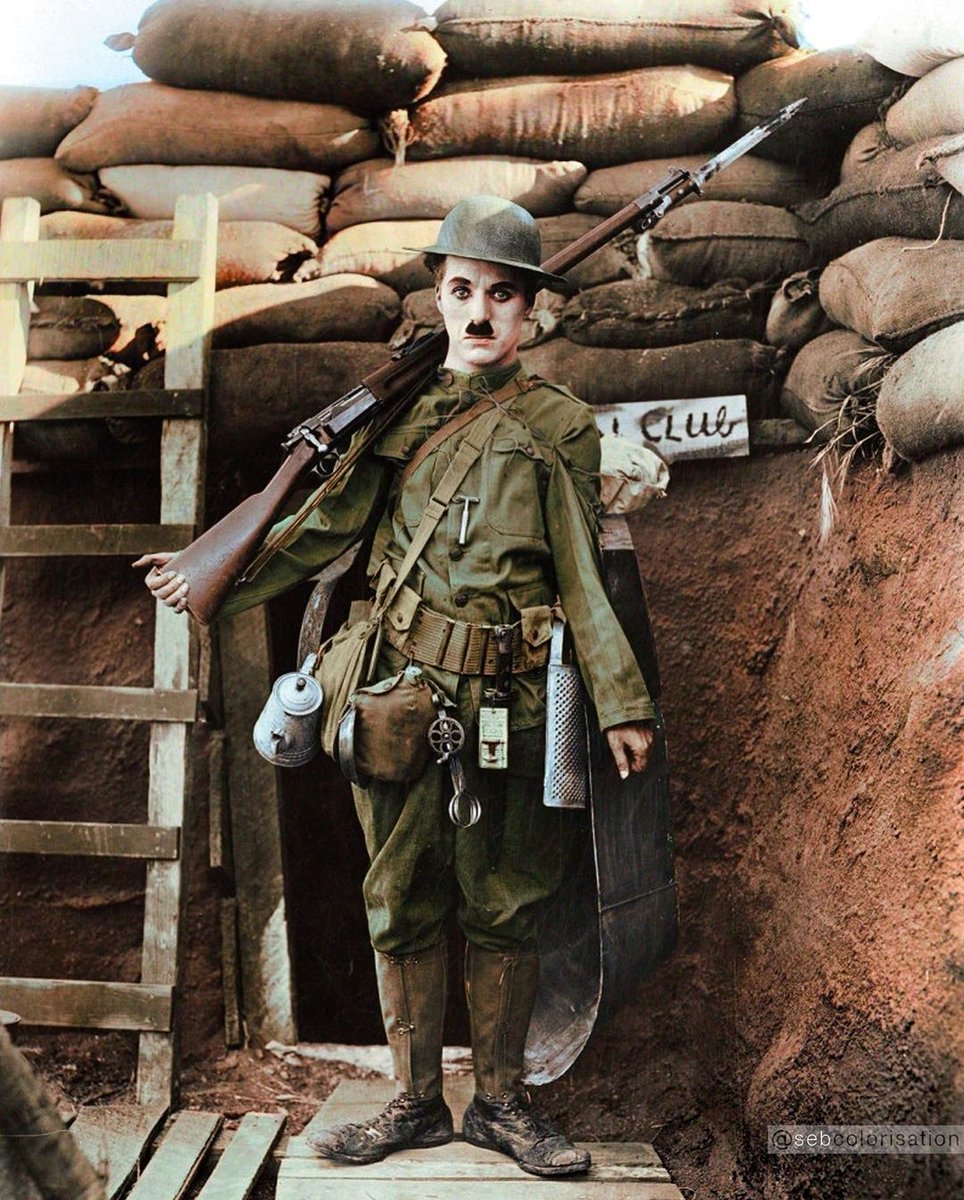 Charlie Chaplin dressed as a soldier in "Shoulder Arms", a silent comedy film set in France during World War I where Chaplin stars as Doughboy. The film became Chaplin's most critically and commercially successful film up to that point. 

Credit: @/sebcolorisation on Instagram