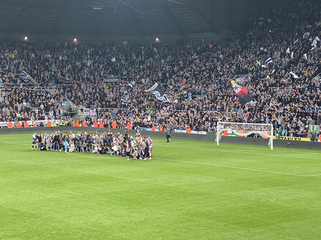 Players and their families pose for a final group photo in front of the gallowgate end #NUFC