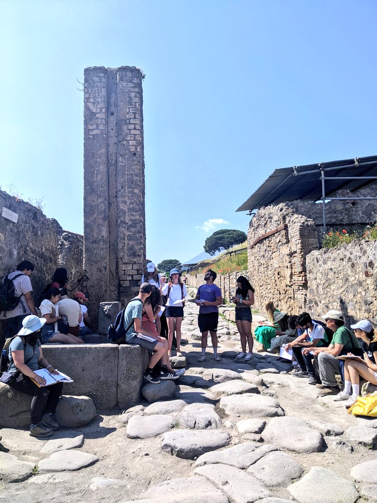 Classics22FSP's tweet photo. Pompeian Presentations! 🌋 @Classics22FSP students kicked off their 1st day at the ancient city with reports on #textile production at the building of Eumachia &amp; #Roman water systems + infrastructure at the fountains and water towers near the Castellum Aquae. 

#pompeii #italy https://t.co/G0RuDB3Vbe