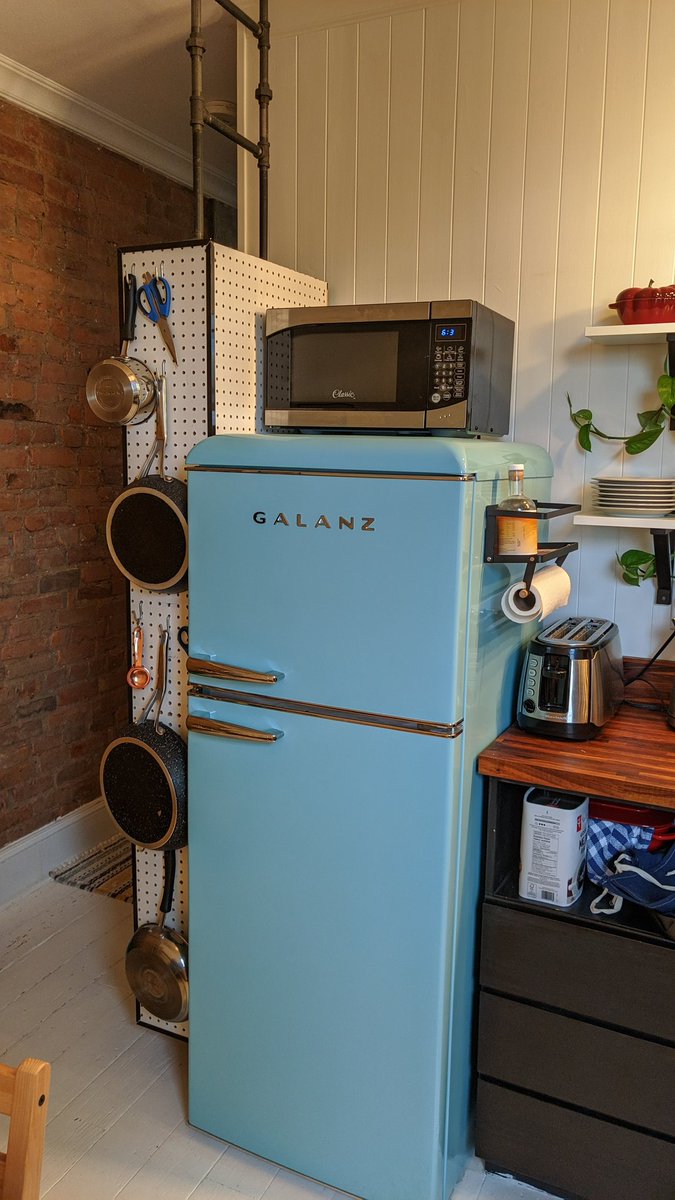 jill_marenger's tweet photo. @Remember_Sarah if you have an open side of your fridge, I am very fond of our little pantry (plain wood doors open on left side), and the magnetic paper towel holder https://t.co/QVCeQnUXku