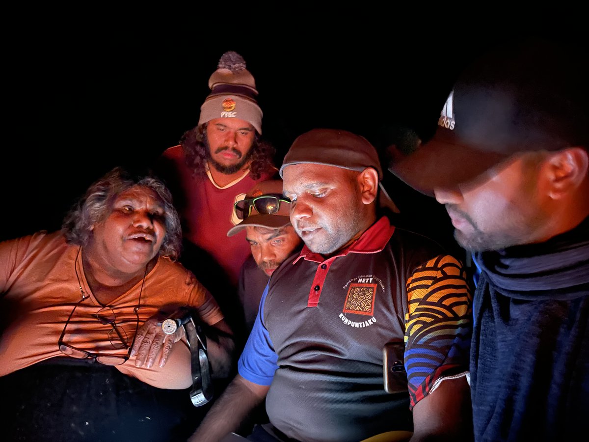 PYECAC's tweet image. Three times a year PYEC comes together to build our team&apos;s sense of pride in working for an Anangu organisation. 

Around the campfire in the evening we learnt open tjukurpa (story) from Josephine Mick and practiced inma (song and dance) together.