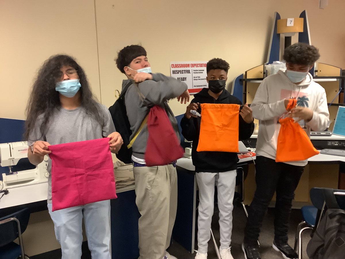 8th graders in Tech and Living proudly show off their drawstring bags! #lifeonmarrs