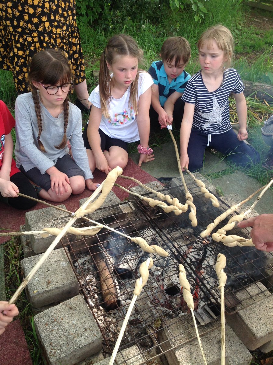 HollyfastSchool's tweet photo. Using our sticks from last week, 3MM cooked bread twists over an open fire. What an experience! #yummy #fulltums #chocolatespeadfaces https://t.co/KYYxiI52qt
