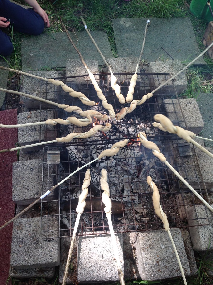 HollyfastSchool's tweet photo. Using our sticks from last week, 3MM cooked bread twists over an open fire. What an experience! #yummy #fulltums #chocolatespeadfaces https://t.co/KYYxiI52qt