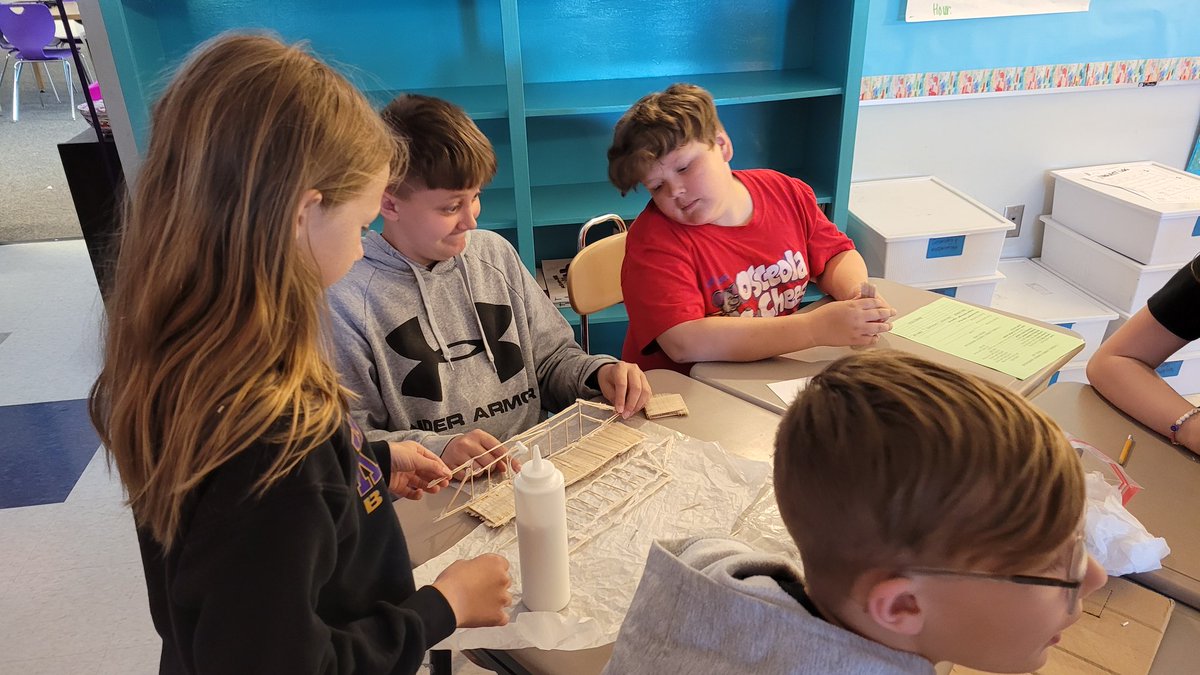 MrsThomasTeach5's tweet photo. This week's #PBL bridge challenge is to take their bridge and adjust their design to make it stronger. Many groups have gone back to the drawing board to redesign their bridge! 💜💛💜 https://t.co/HMWTgUTa6r