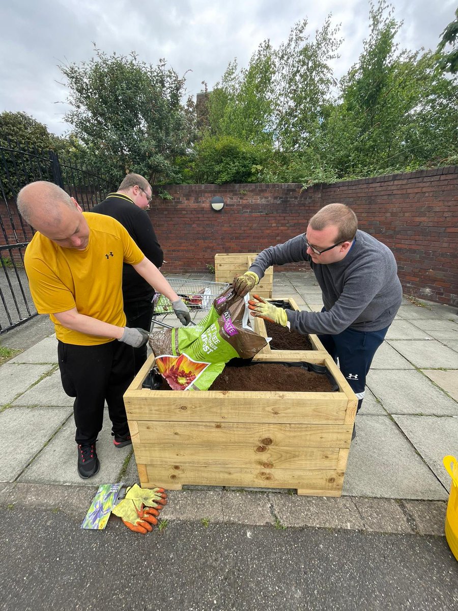 Look at these lovely photos of our Wirral Mencap Gardeners at Make Hamilton will cheer everyone up!
Here's the team working hard to get the raised beds ready for planting, putting old vegetation into the compost bins and placing straw around the strawberry plants.