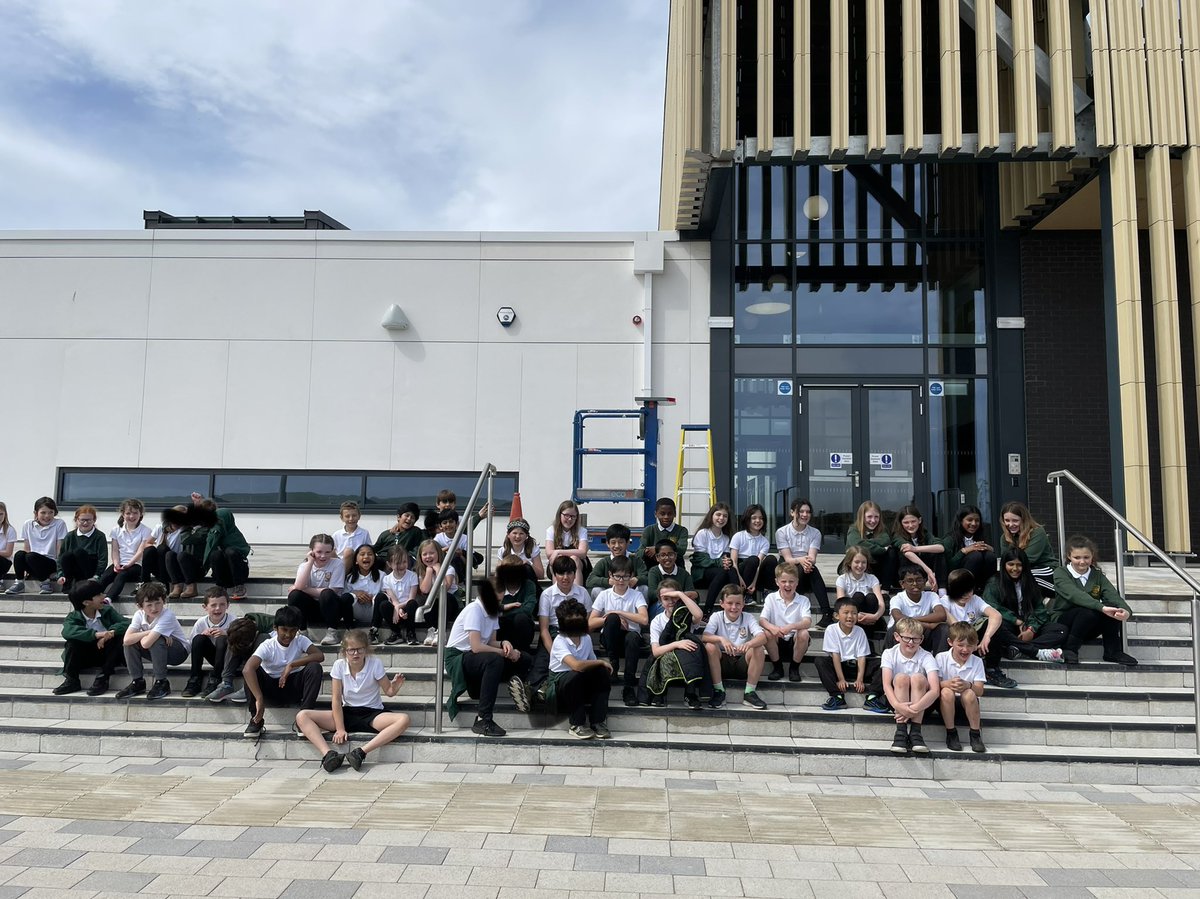 P3 and P5/6 excitedly waiting for their first tour around the new school.