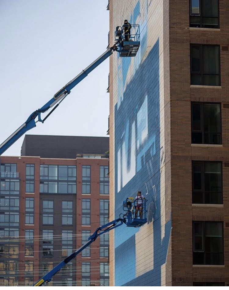 TRAVMSK's tweet photo. Office with a View. 12 story mural in DC with @_emjayism_ #travmsk #traviswashere #mural #publicart #DC https://t.co/e0EoTfxgfl