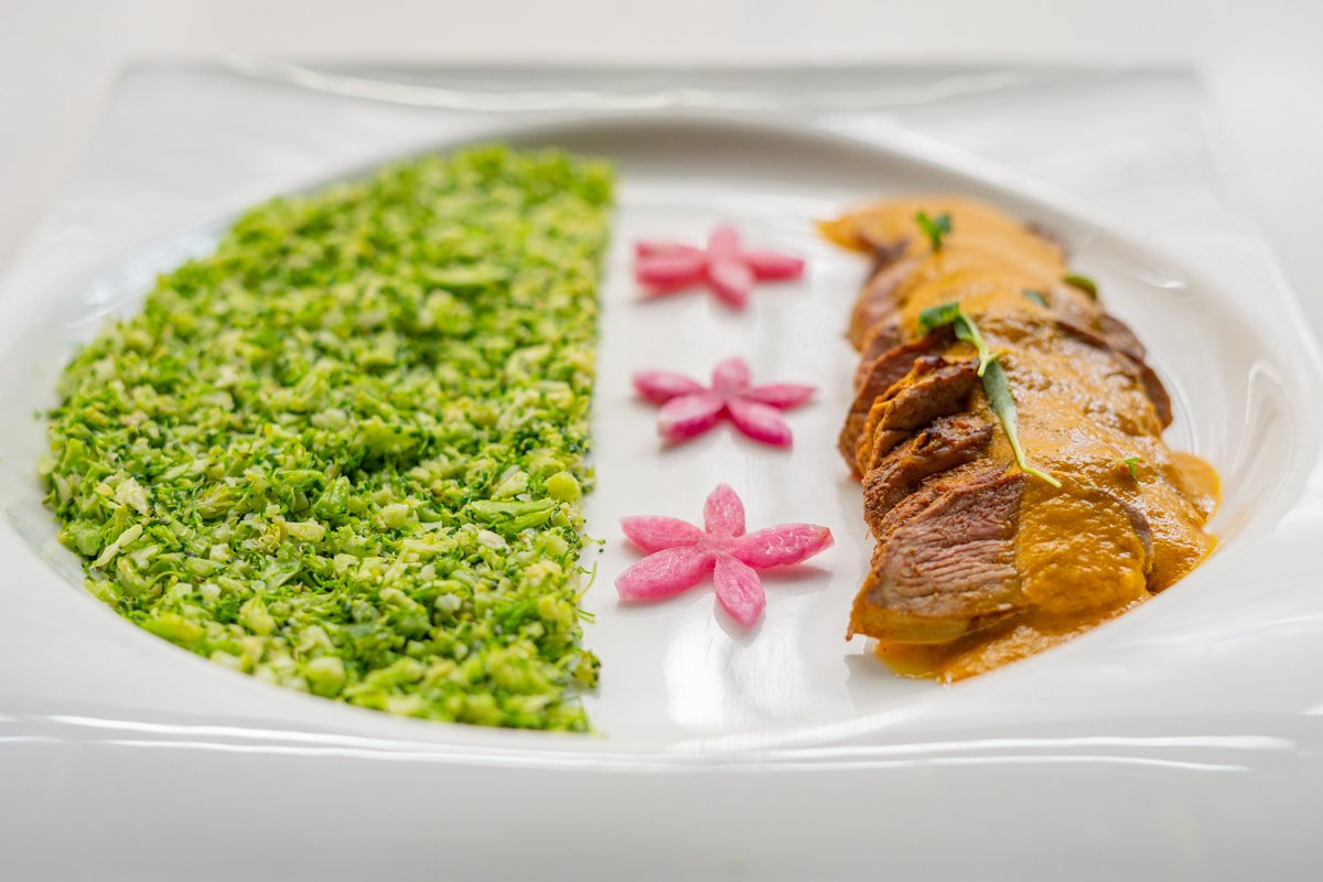 Saffron Duck - new to the menu from Chef Ajay and never before offered - is a seared duck breast with saffron and fennel gravy, served with broccoli rice. 

Servers pour the perfectly balanced sauce over the seared duck at the table for a stunning presentation.