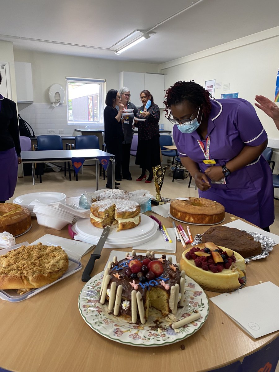 I spy ⁦<a href="/midwifemarge/">Lynn Maycroft</a>⁩ and ⁦<a href="/ratansiz/">💙Zebina Ratansi, MBE, RN💙</a>⁩  sampling the delicious #InternationalDayOfTheMidwife bake off #cakes in the corner ! #IDM22 #IDM ⁦@WhippsCrossHosp⁩ ⁦<a href="/MaternityWX/">Whipps Cross Maternity</a>⁩