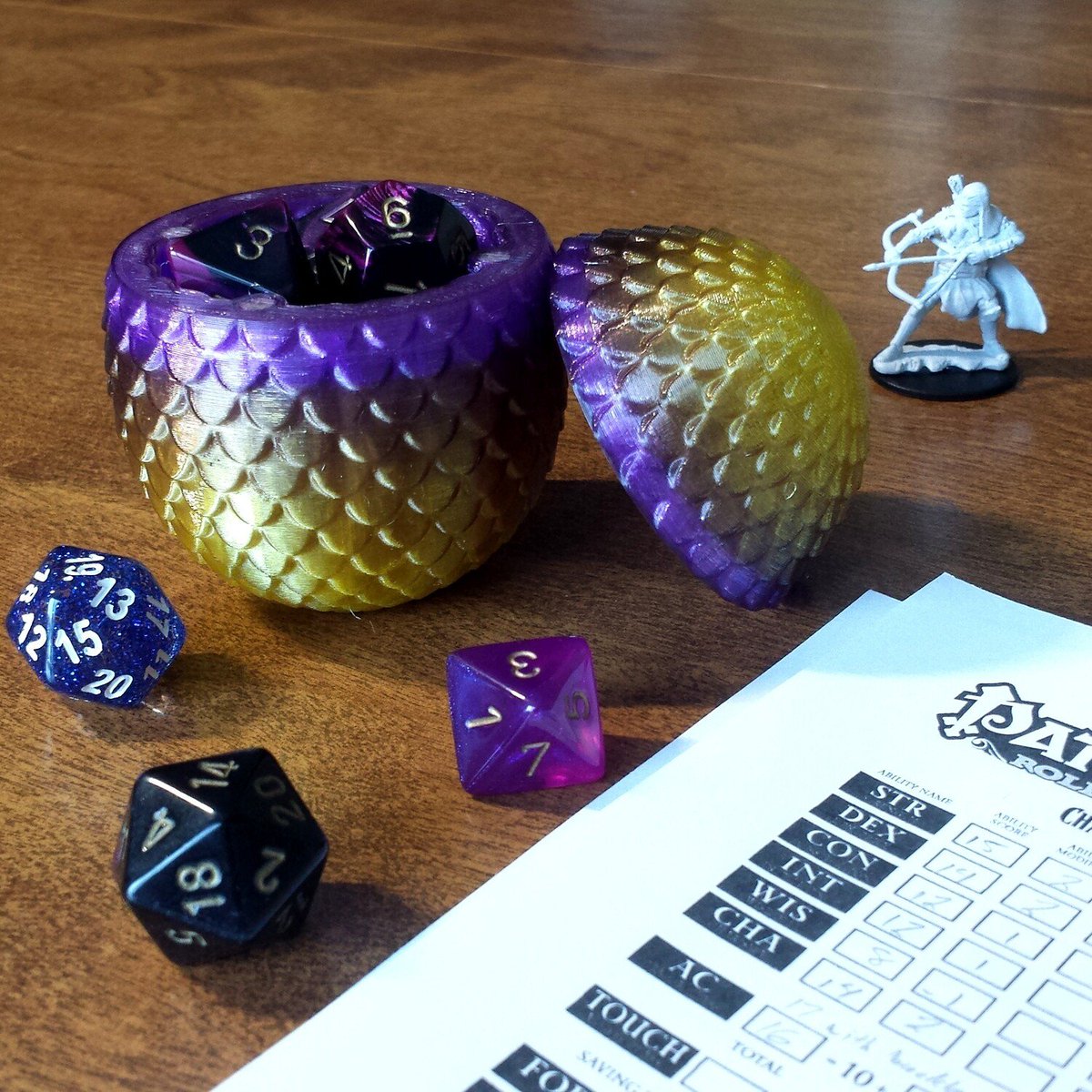 SpoutLore's tweet photo. This Sunday, May 8th at 11am PST we'll be streaming our Q&amp;A LIVE from THE ACTUAL WOODS  (hopefully). We'll also be giving away these awesome prizes from @FantasyBy including dice earrings, woodcut bee pins, and a Thunderbird dice egg!

Not a patron yet? RT for a community pass! https://t.co/AYL6tq4AEJ