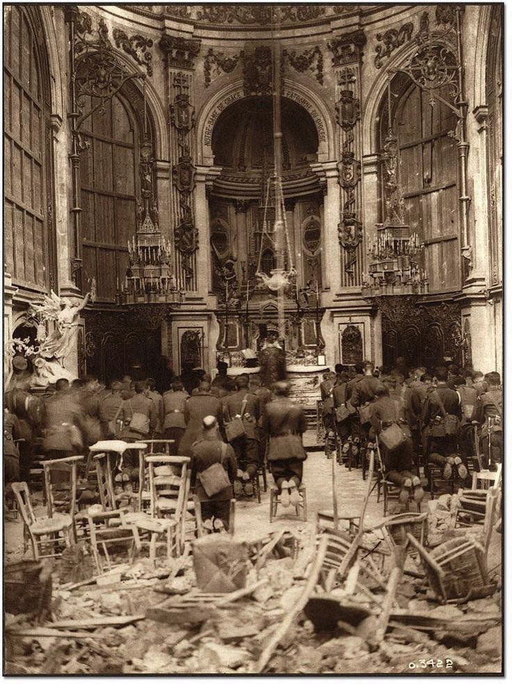 NosQuae's tweet photo. Canadian troops attend a Thanksgiving service in the bombed-out Cambria Cathedral in France, October 1918

#histphotop https://t.co/uXN47xRDzf